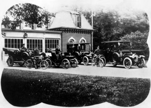 Official White House fleet with drivers and motorcycle police in 1909 at the time the White House stable became a garage.